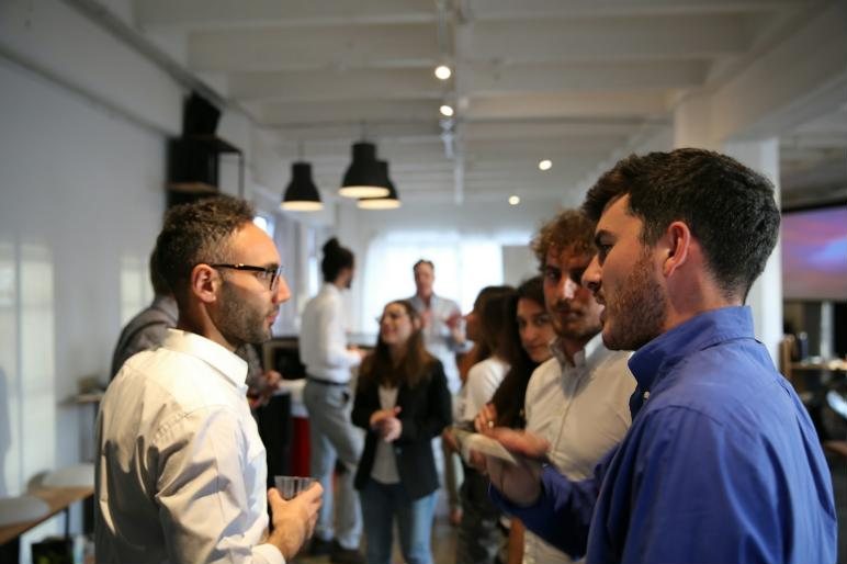 Professionals talking at a networking event